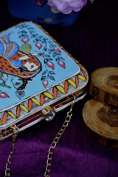 "Sacred Love: Radha Krishna Hand-Painted Clutch – A Divine Accessory"