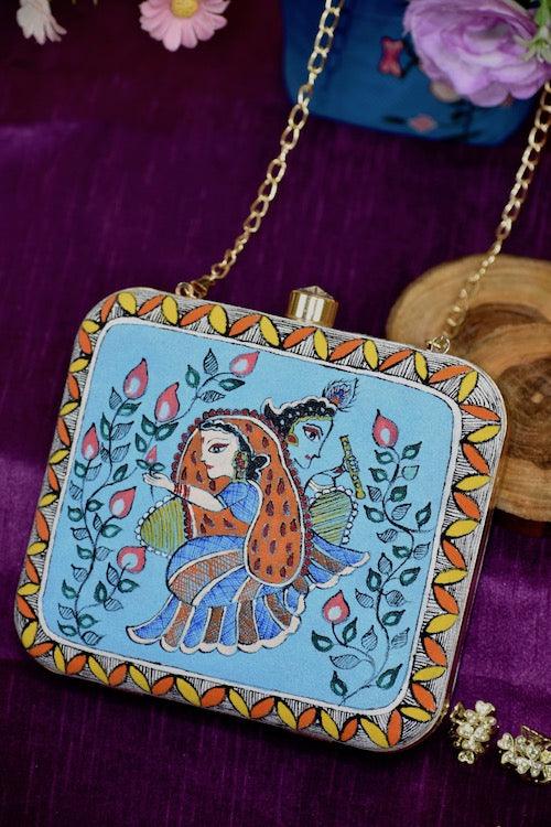 "Sacred Love: Radha Krishna Hand-Painted Clutch – A Divine Accessory"