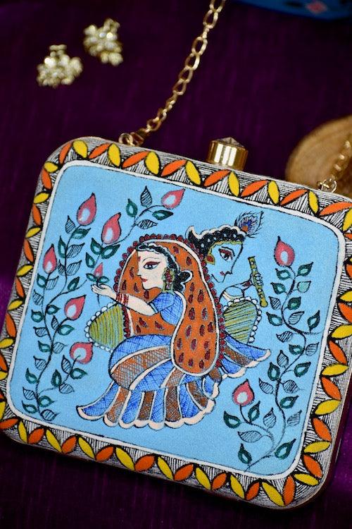 "Sacred Love: Radha Krishna Hand-Painted Clutch – A Divine Accessory"